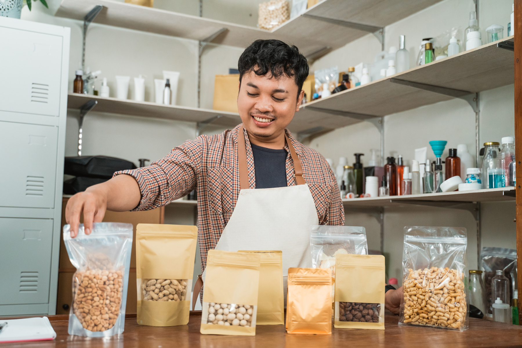 Portrait Young Man Selling Packaged Products