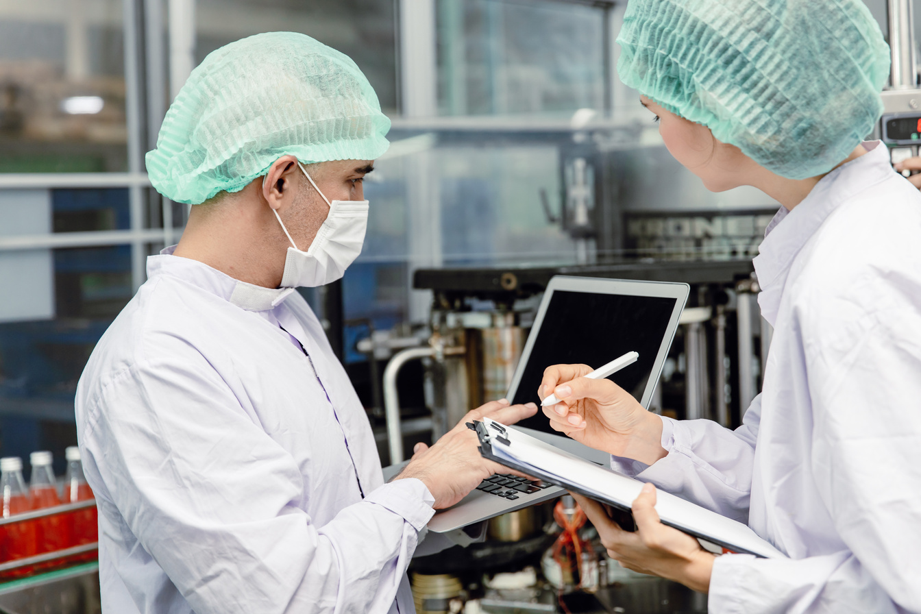 Quality Control and Food Safety Team Inspection the Product Standard in the Food and Drink Factory Production Line.